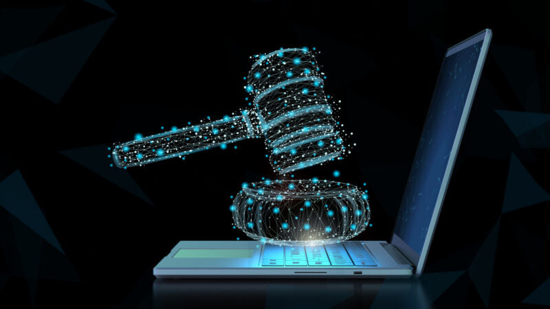A computer-generated gavel hovers over a laptop